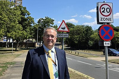 Cllr. Paul Zukowskyj with 20mph signage